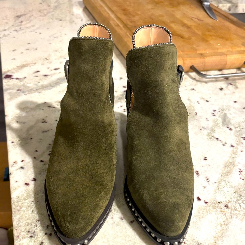 Coach ankle boots has not been worn. Very nice with studs